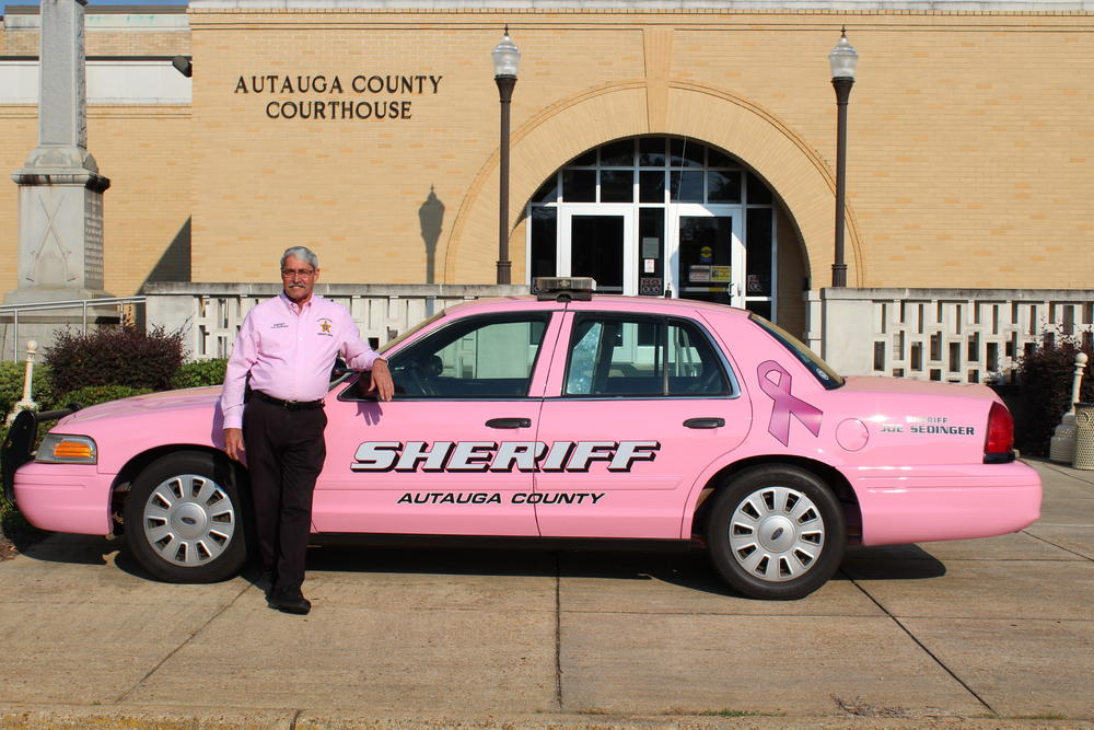 Sheriff Sedinger with the pink patrol car